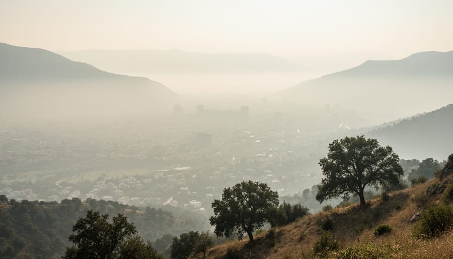 Hazy view of a valley near Vernon with distant mountains obscured by smoke or air pollution